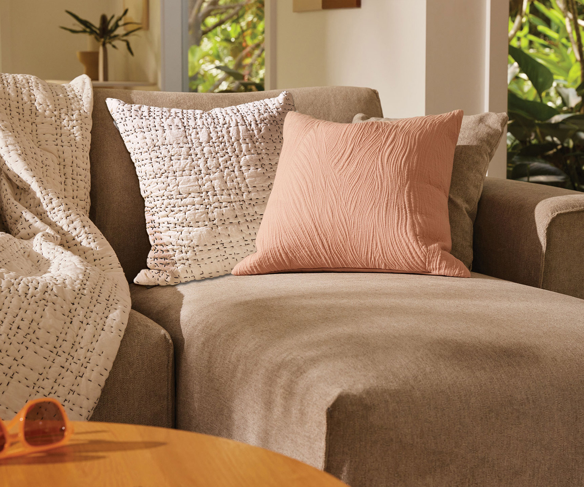 Styling couch cushions is easy with this collection of cushions from the Koala range, which are sitting on a sofa with a Koala throw
