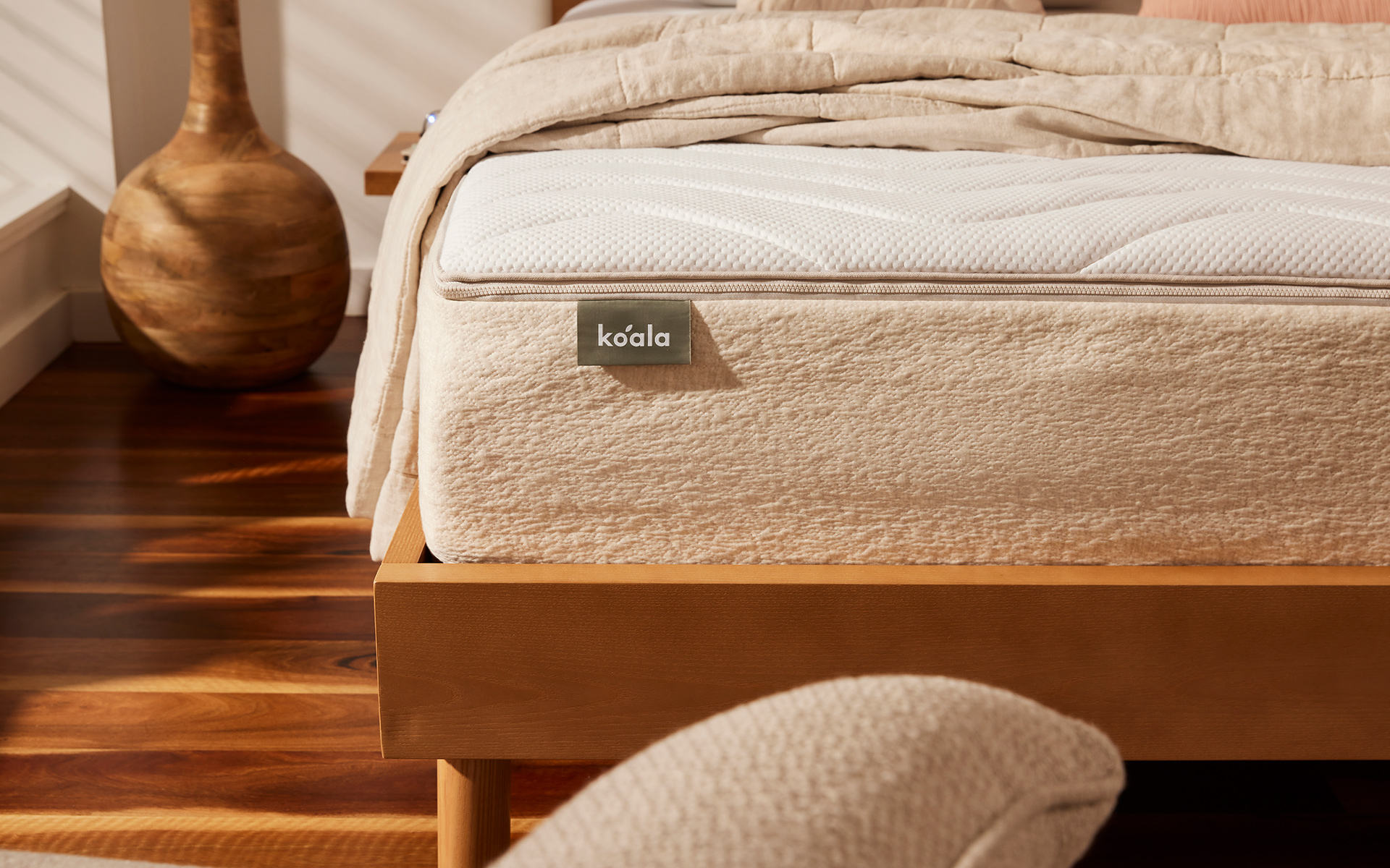 A close-up image of a Koala mattress on a timber Balmain Bed Base